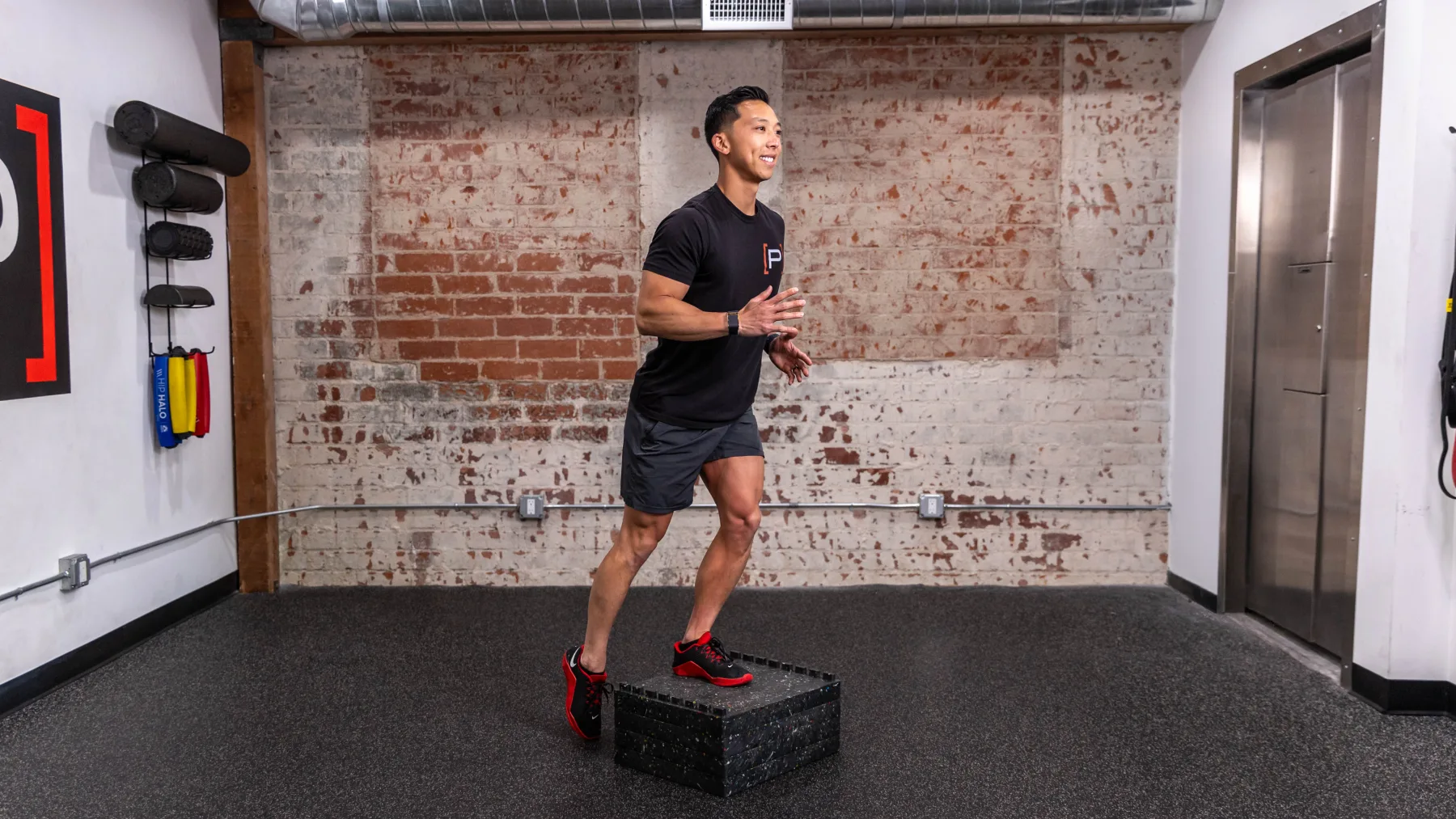A Doctor of Physical Therapy doing a step-up on a box in the Prehab clinic