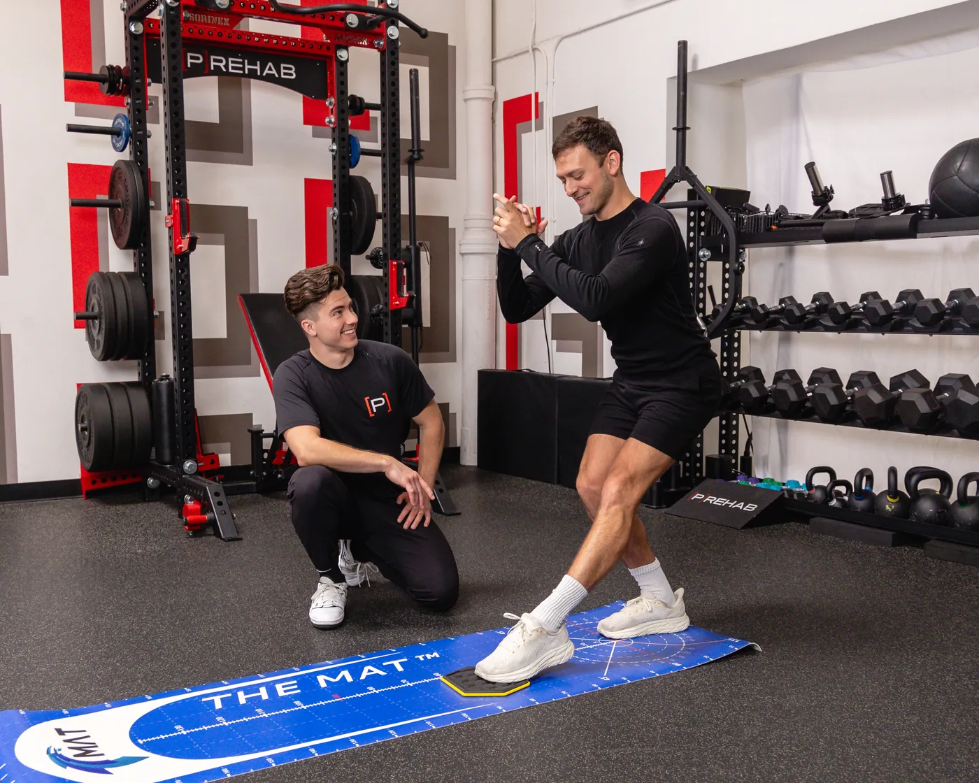 An athlete performing agility testing on a force mat