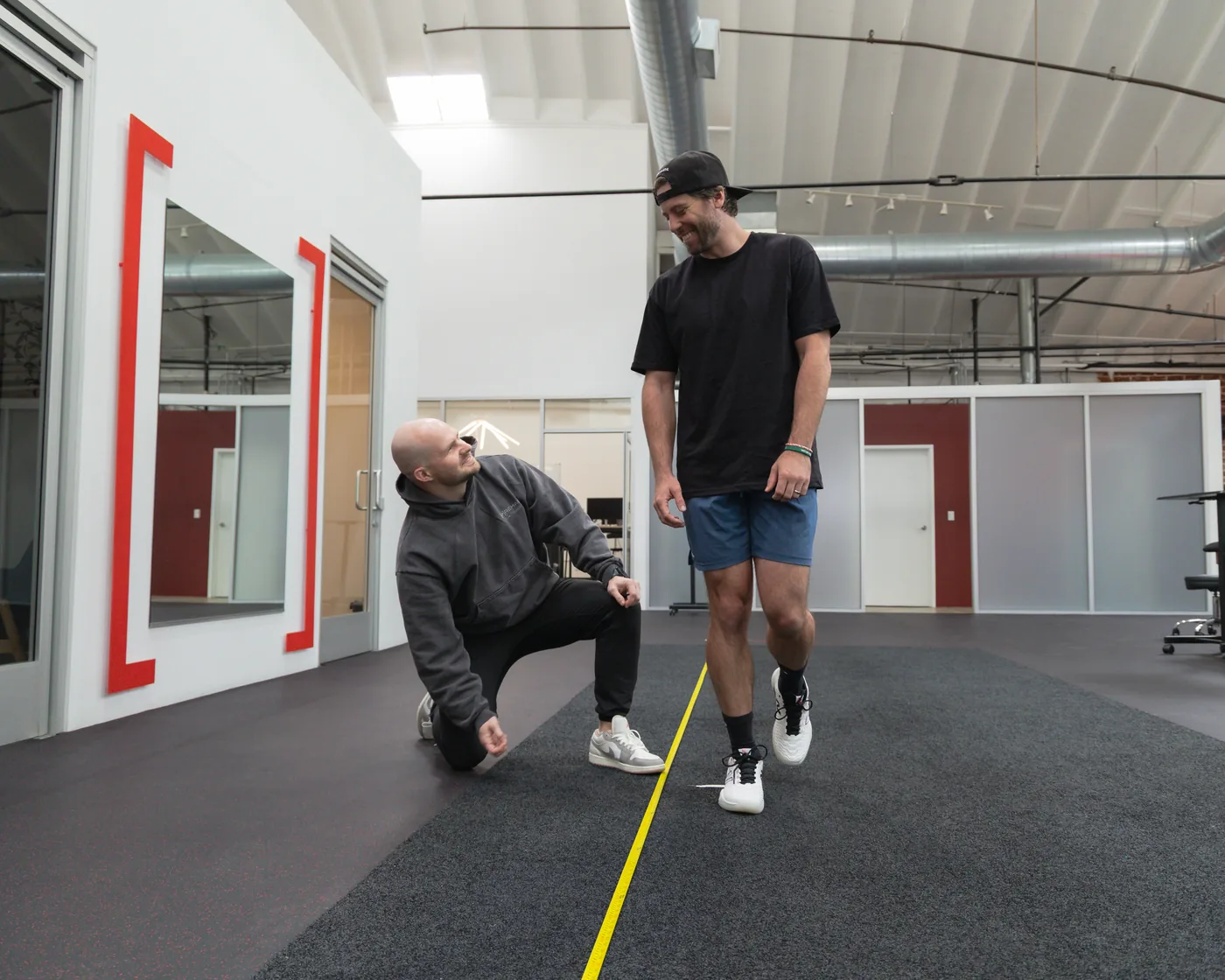 A Prehab physical therapist observing an athlete during movement testing